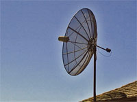 GtB 8 foot satellite
                                dish on a roof in Belize